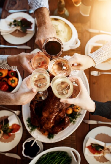 Toasting with wine at a Thanksgiving meal.