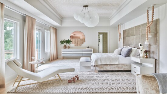 A fully custom bedroom, including a rug that's meant to echo the waves in the lake visible from the window.