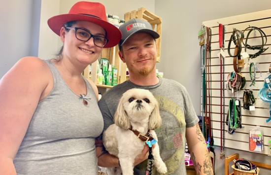 Opie, a Shitzu, poses with owners Jackie & Josh Westadt.