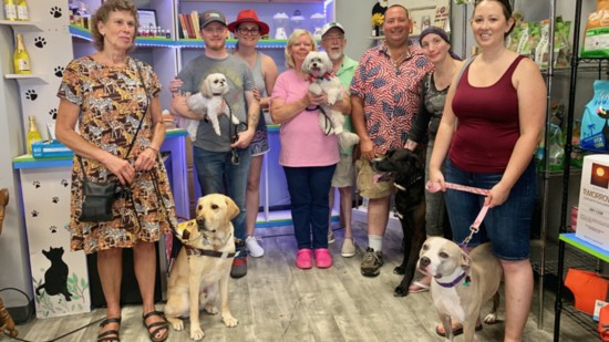 Pet lovers celebrate the opening of Main St Pet Boutique. 