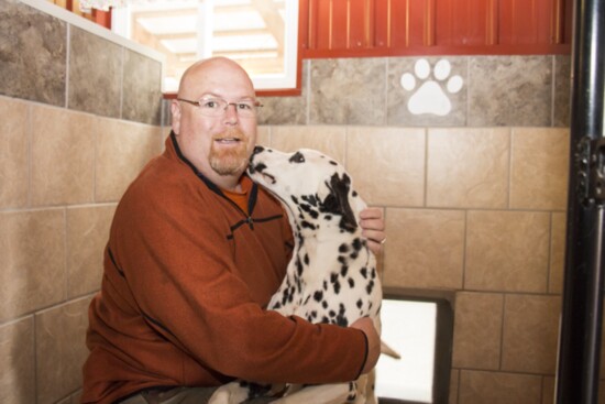 Petland Tulsa owner Carl Swanson visits with one of the breeders he works with. 
