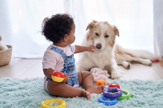 Baby with a dog.