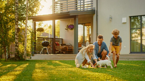 A family with a dog.