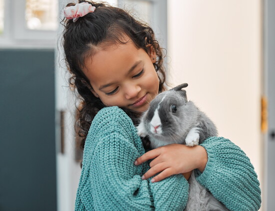 Child with a rabbit.