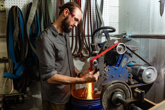 ohn Phillips, Founder of Phillips Forged & Primeaux Knives in his Knoxville workshop