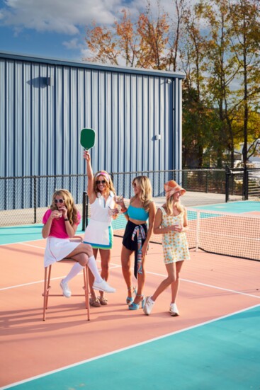 Jillian is wearing the French Connection Vhari Short Sleeve Jumper from Belk, Lucky in Love Stripe Skirt Long from Court 1 and Cole Haan shoes. Leigh emodies 