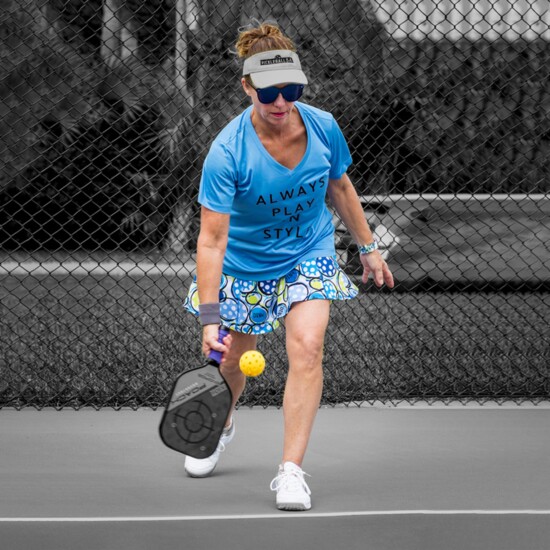 Pickleball Bella’s Dink 1 A-Line skort, short sleeve v-neck, and visor.