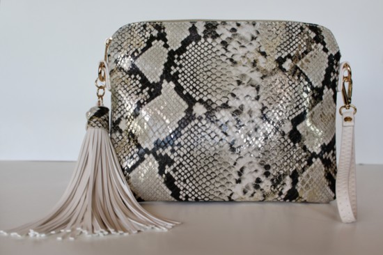  34.00 Sleek snakeskin look in this wristlet/crossbody, pair with other Fabs in this collection