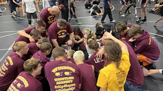 Coaches and wrestlers huddle prior to the 2026 Colorado State Freestyle & Greco Championships bringing home over 20 state medals in WWA's first year.