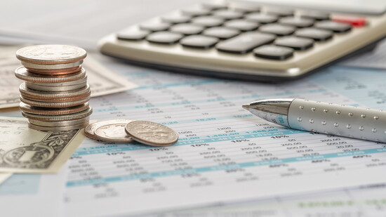 Calculator, change, and a pen.