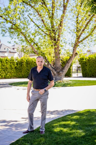 Lonnie McCleve standing before the 'Grandfather Tree'.