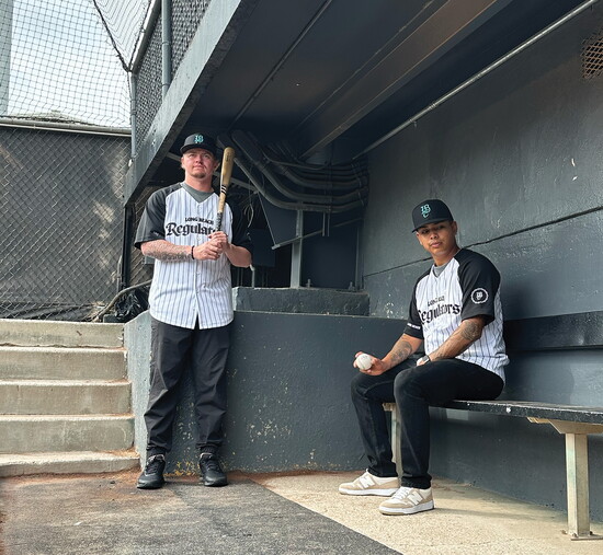 Brett Wozniak (left) and JJ Almeda (right) visit the dugout at Blair Field before the start of the season. 