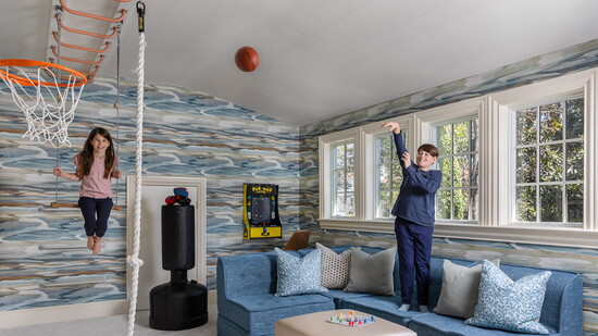 The Quisenberry children have multiple activity options in their revamped playroom. The modular sofa, sourced by Wild Child, is accented with pillows in a