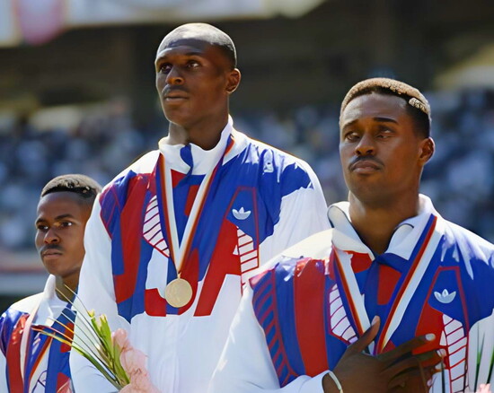 L–R: Danny Everett (bronze), Steve Lewis (gold), and Harry “Butch” Reynolds (silver) on the Olympic podium in Seoul, Korea.