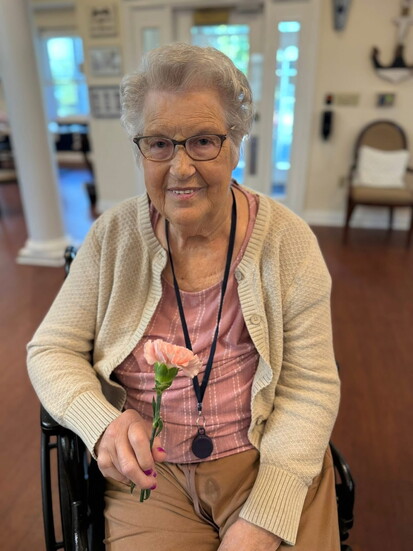 Caryl pictured with one of her favorite flowers.