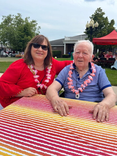 Rabbit, pictured on the right, enjoys the sunshine during a recent luau-themed party.