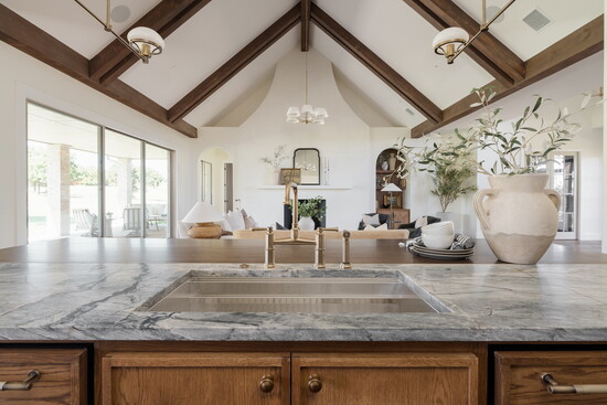 The kitchen island features an unusual and eye-catching countertop that Chris Kregger personally designed on-site. 