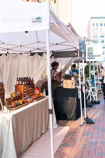 Vendors take part in the weekly festival on Pratt Street.