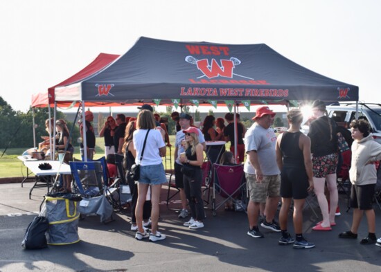 Firebirds from a variety of school clubs and organizations set up spots at the football tailgate.