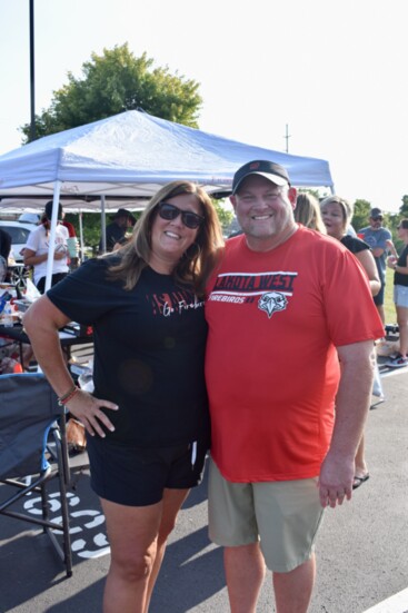 Athletic Booster Volunteers Arin + Jason Bonk at the Lakota West Firebirds Tailgate event.