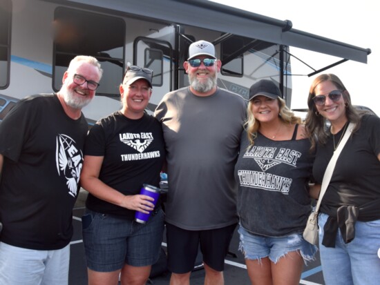 Thunderhawks fans get fired up at the football tailgate party before the varsity game.