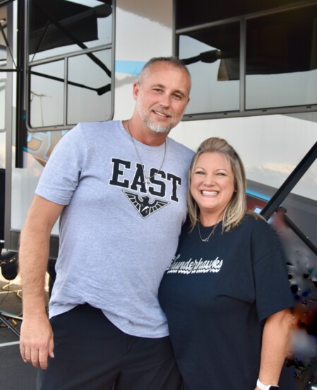 Athletic Booster Volunteers, Lakota High School alum + football parents Steve + Tricia Chaney host the Lakota East Thunderhawks Tailgate event with their RV.