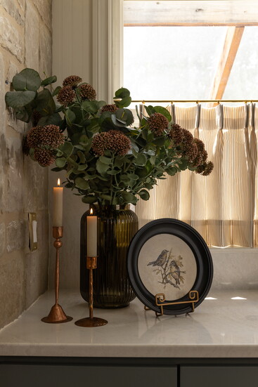 This vignette in the corner shows off some of our Boerne Farmhouse treasures and a painting by Shiloh Billingsley.