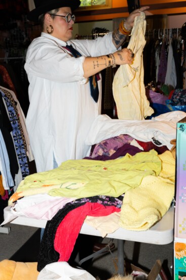 Owner Greta Allendorf inspects items brought in by individuals hoping to sell them. 