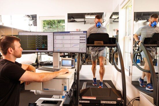 A cardiopulmonary exercise test for a member's heart, lungs and blood pressure being conducted while he exercises on a treadmill