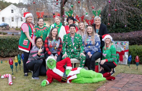 Brian and his team with the Grinch on their first Grinch Day! Photo: MaddyEm Photography