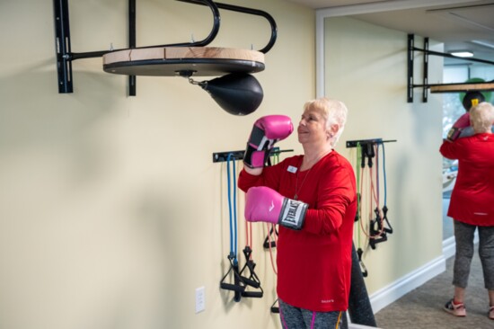 Village On The Isle resident Pat Walther works on a speed bag.