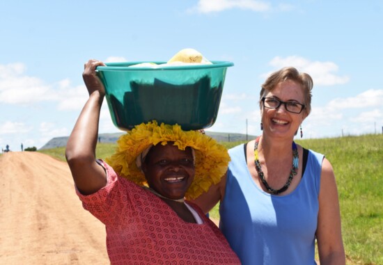 Giving food buckets to elderly Zulus