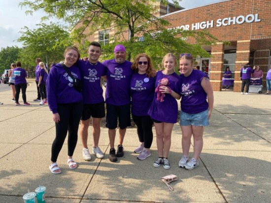 The Vanoss family with the purple monkey at the 2023 Reagan's Fun Run 5K.