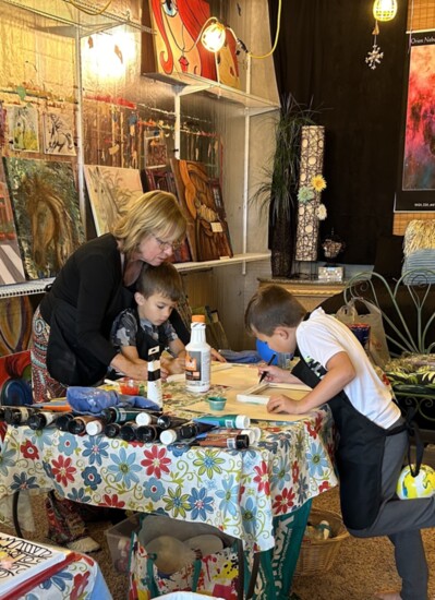 Mari Knight with grandsons Colson (5) + Landon (7) in the Purposeful Painting studio.