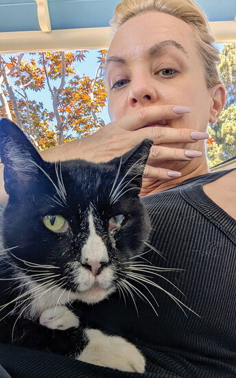 Wendi takes a selfie with her cat, Harvey.