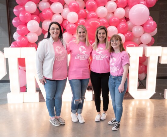 Some of QCB’s Financial Literacy all-stars at a pink-out basketball game! From left: Kathleen Mastbrook, Dianna Pritchett, Pam Duran, Allie Richardson