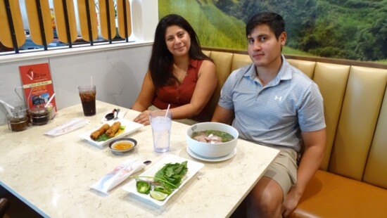 A young couple enjoying their food at V-Bistro.