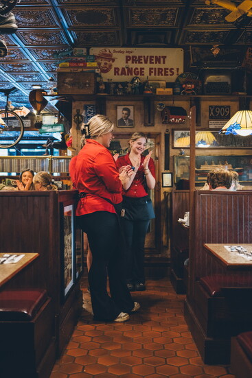 Staff celebrating with patrons at Antonio's Restaurant in Simsbury