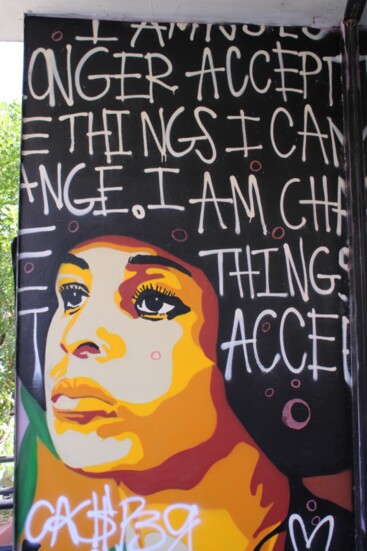 Angela Davis mural in front of Charm School Vintage. Image by Julie Royce