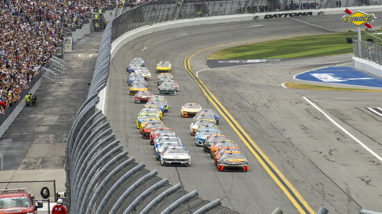 Chase Briscoe, driver of No. 19 Bass Pro Shops Toyota leads the field after taking the green flag to start the NASCAR Cup Series Daytona 500