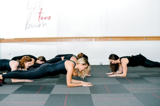 Holding a plank position.