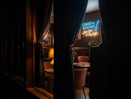 The Rapids Lodge speakeasy blends vintage charm, cozy seating, and  handcrafted cocktails.