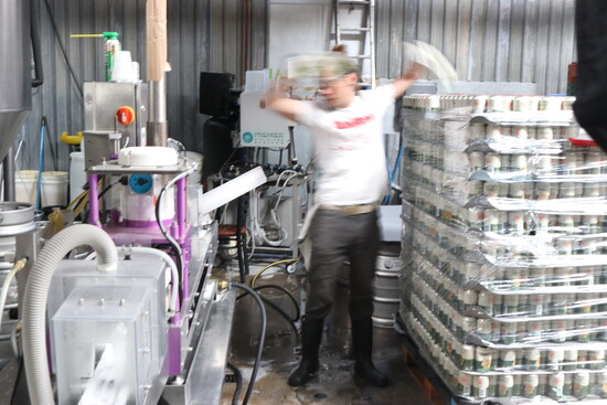 Mr. Nixon in full motion feeding cans.