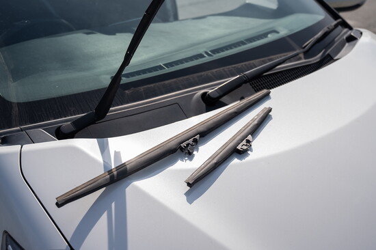 Windshield wiper blades on a vehicle.