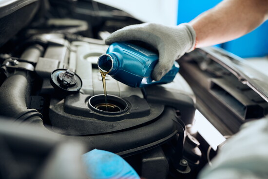 Oil being poured in an engine.