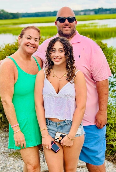 Amy Goldstein with her husband Eric and daughter Taylor, the family that inspires her philosophy of treating every client like one of her own.