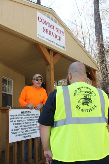 Al Yougel chats with a worker at the McIntosh Recycling Center. Keep Peachtree City Beautiful welcomes volunteers. 