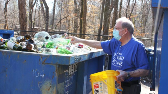 Jorgen Brandt-Nielson brings glass bottles for recycling at McIntosh Trail Recycling Center. 