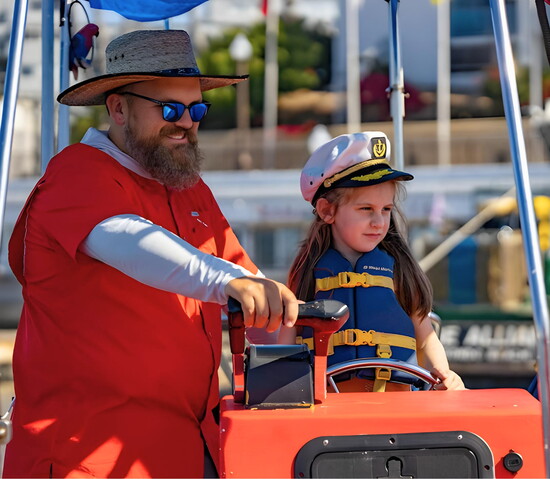 Redondo Glass Bottom Boat owner Jake Mark with one of his many young captains. Photo Credit: Jake Mark