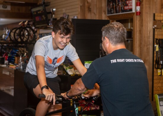 David Hardin shows Kaedyn Hinkle how to choose the right size of bike.